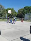 Mr. Kelly playing basketball with the students during earned AT!